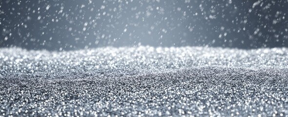 Sparkling ground with snowfall, in tones of silver and gray