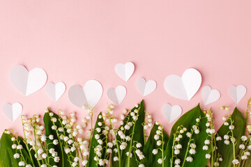 Bouquet of flowers and paper hearts on a pink background. Concept of romance holiday, 14 february, Saint Valentine, 8 march, woman day, mother day, copy space