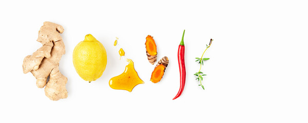 Natural immunity booster ingredients isolated on white background. Ginger, lemon, honey, turmeric, chili and thyme composition