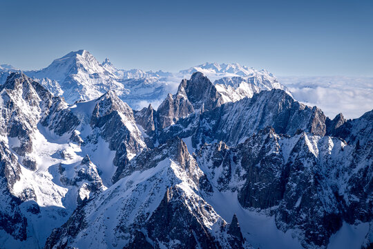 Sharp peaks in the Alps in winter, Chamonix-Mont-Blanc. Snow-covered mountains in Europe. Breathtaking mountain landscapes. - Powered by Adobe