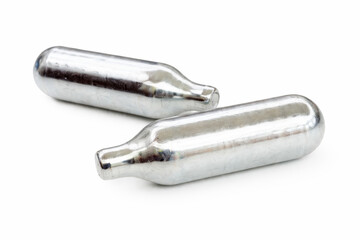 Metal gas cartridges isolated on white background, industrial object close-up