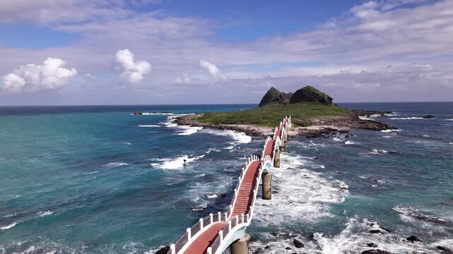 B roll of the Sanxiantai eight arch bridge in Taitung featuring a dragon shaped pedestrian bridge linking Taiwan and Sanxiantai Island with dramatic volcanic coastal landscapes