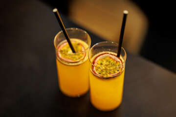 Two Passion Fruit Cocktails With Fresh Fruit Topping