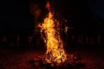 Large Bonfire Burning Brightly at Night Outdoors
