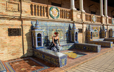 the beautiful Andalusian girl sitting in one of the most beautiful monuments in all of Seville