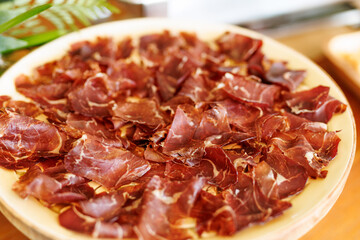 Plate of Thinly Sliced Cured Meat on Serving Tray