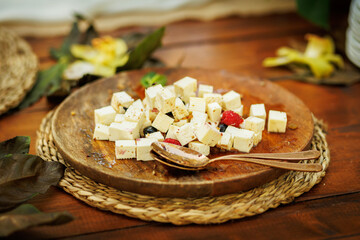 Wooden Board With Cubes of Cheese and Fresh Berries