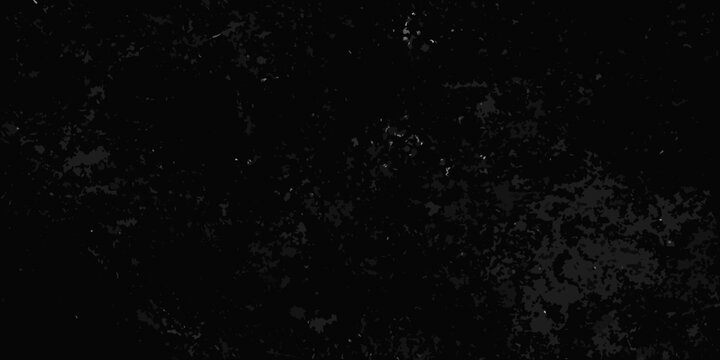 A dark almost entirely black image with subtle grainy texture and minimal light