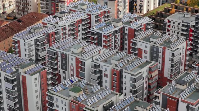 Aerial video of Kor&ccedil;&euml;&rsquo;s modern residential blocks featuring solar-paneled rooftops, balconies and dense urban architecture.