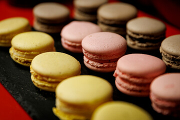 Colorful assorted macarons on slate