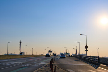 Cars headed somewhere in the evening when the sun began to set