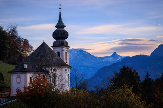 old church of maria gern in the bavarian alps with watzmann at sunset in autumn