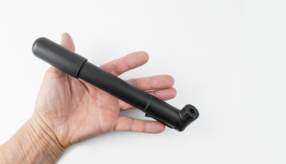 Small mini bicycle pump on a white