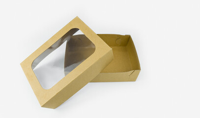 Empty brown paper box with transparent window isolated on white