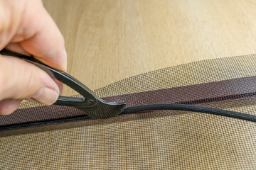 Installing the net into the window aluminium frame or door