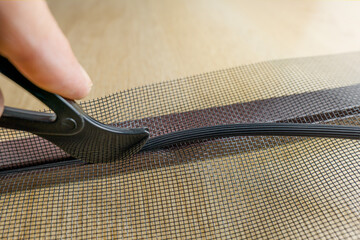 Installing the net into the window aluminium frame or door