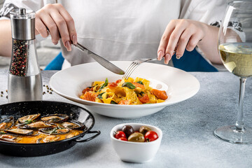 Woman Eating Pasta With Seafood And Wine