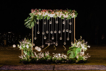 Romantic Floral Wedding Arch Glowing at Night Event Decoration Ceremony