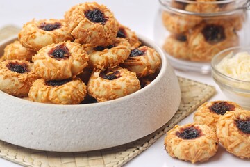 Homemade Thumbprint Cookies filled with chocolate jam and grated cheese