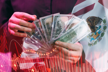 Money in hands in front of Mexican flag with financial growth graph on the background
