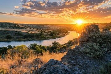 Stunning sunset over a winding river with golden light illuminating the landscape