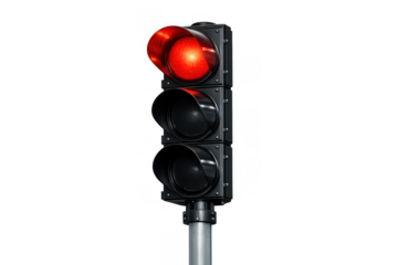 Traffic light with red stop signal illuminating, controlling road traffic flow, ensuring safety regulation