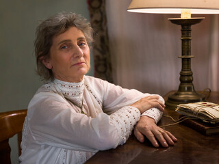 Edwardian lady posing at her piano
