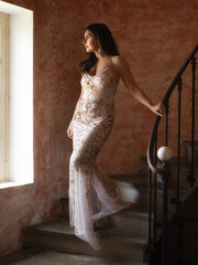 Woman in gold evening gown