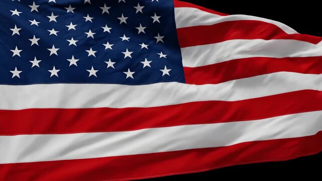 Close-up of the American flag waving in the wind, symbolizing patriotism and national pride.
