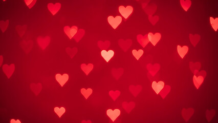Romantic red hearts bokeh effect background for a love celebration or greeting card
