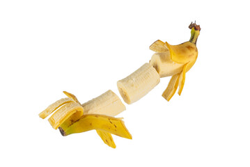 Banana peeled and divided into segments in a dynamic arrangement. Concept of fresh fruit, healthy diet, and creative food presentation.