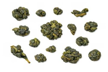 Dried loose leaf oolong tea scattered on transparent background, showcasing healthy beverage ingredients and natural wellness