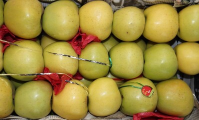 Golden delicious apples arranged for sale