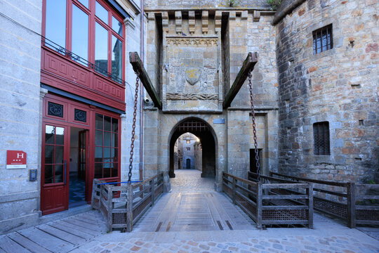 gate and narrow street in the ancient city of mont saint michel abbey france