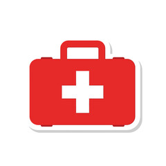 Obraz premium Red first aid kit with white cross on handle