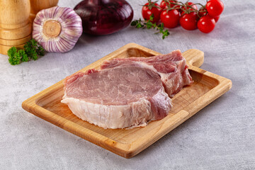 Raw pork steak with bone