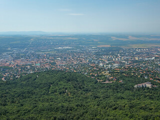 Obraz premium Twenty-first image in a series presenting a panoramic view of the city of Pécs, Hungary, photographed from the observation deck of the TV tower. Elevated perspective highlighting the urban landscape, 