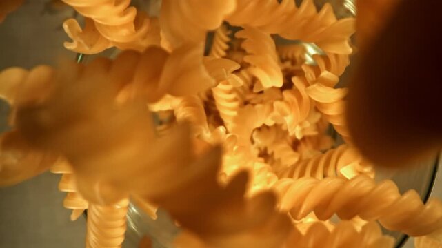 Super slow motion fusilli pasta dry . Filmed on a high-speed camera at 1000 fps. High quality FullHD footage