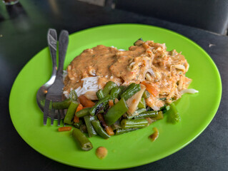 White Rice with Shredded Chicken Curry Gravy and Long Bean Stir-Fry on Green Plate