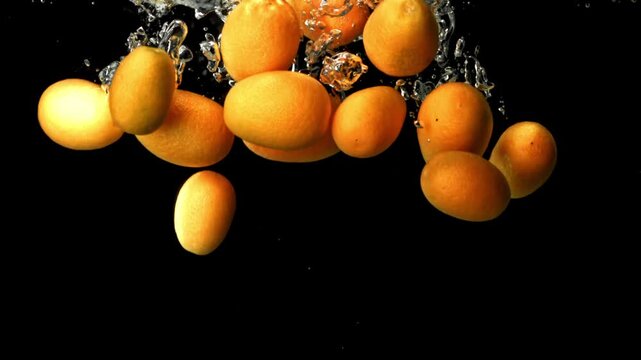 Super slow motion fresh kumquat . Filmed on a high-speed camera at 1000 fps. High quality FullHD footage