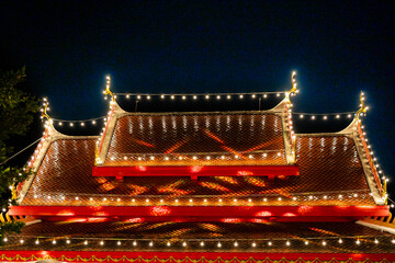 The roof of the buddhist temple at night, Thailand.