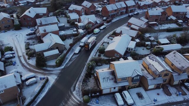 Drone 50fps. UK dustbin collection, garbage truck, snowy winter weather. Hull.UK 10.1.2026
