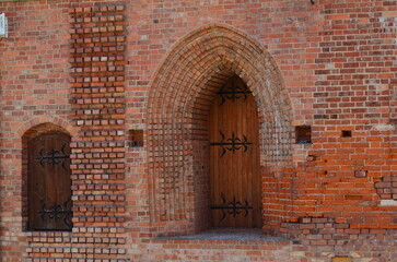 Gothic church portal in a brick wall