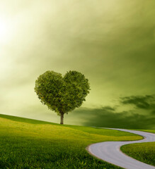 Gewundener Weg vorw&auml;rst durch eine imagin&auml;re Lanschaft zu einem Baum in Herzform