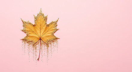 A golden maple leaf adorned with sparkling glitter, positioned against a soft pink background, creating a luxurious and festive autumn aesthetic with ample copy space for seasonal designs and promotio