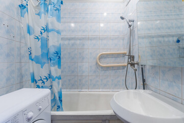 modern bathroom room with toilet and washing machine