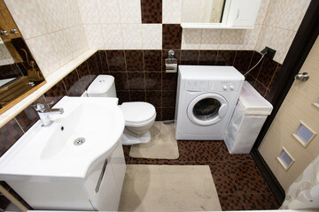 modern bathroom room with toilet and washing machine