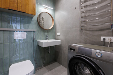 modern bathroom room with toilet and washing machine