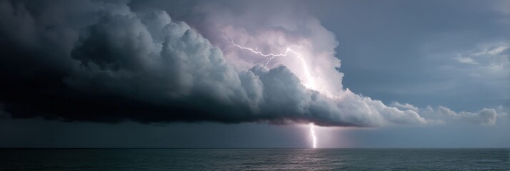 Dramatic lightning strike amidst dark storm clouds over ocean horizon