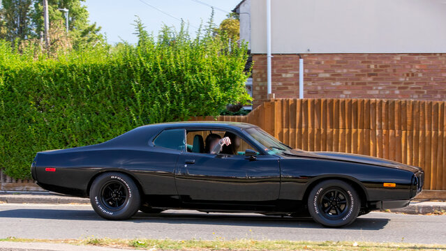 Bletchley,Bucks,UK - Aug 25th 2025:  1973 Dodge Charger classic American car driving on a British road